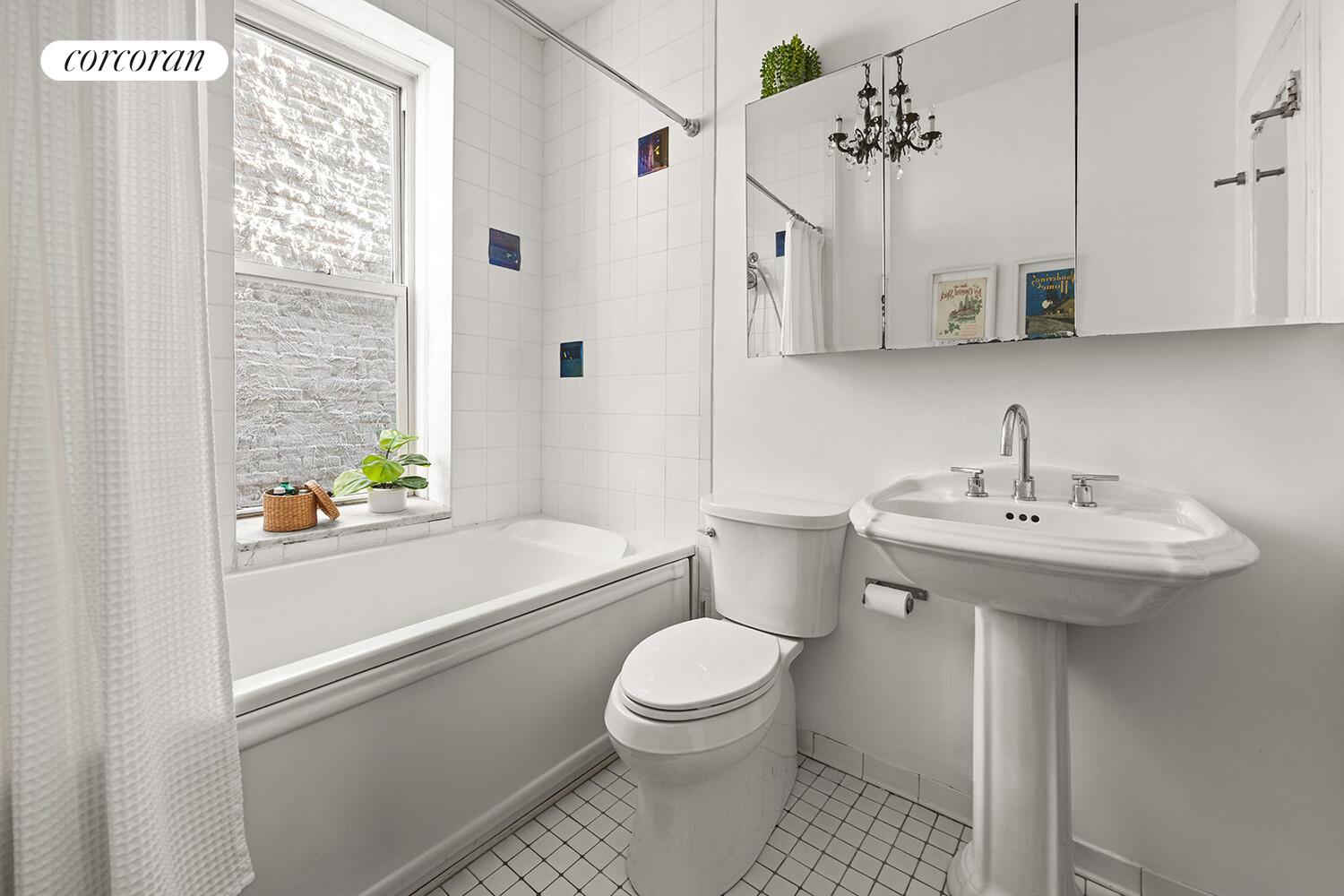433 3rd Street, Unit 3 Brooklyn, NY 11215 - Photo 8 of 12 a bathroom with a sink a toilet and shower