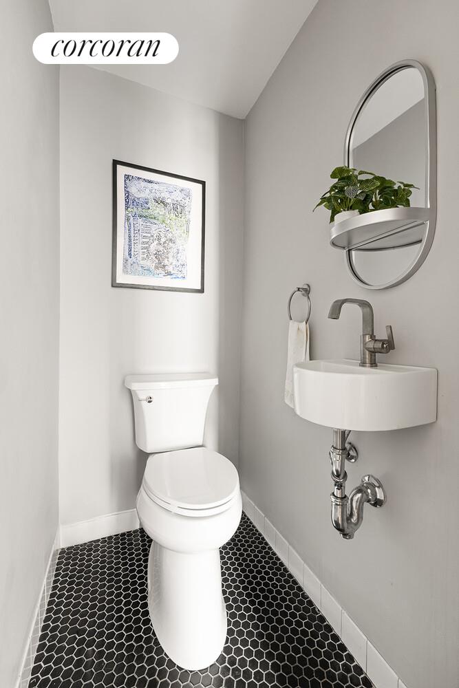 433 3rd Street, Unit 3 Brooklyn, NY 11215 - Photo 9 of 12 a bathroom with a sink toilet and a mirror
