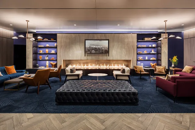 a media room with lots of chairs and a projector screen