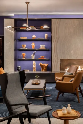 a view of a house with a backyard and sitting area