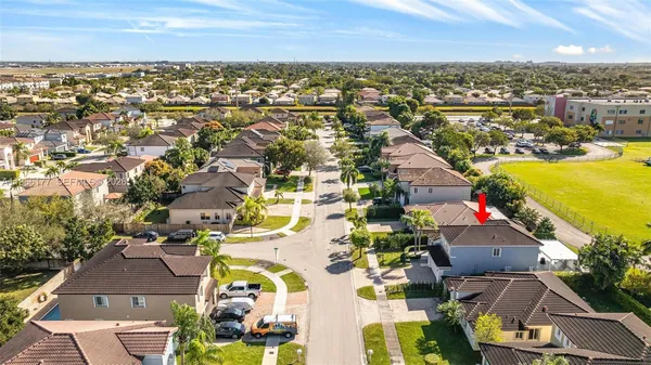an aerial view of residential building and lake