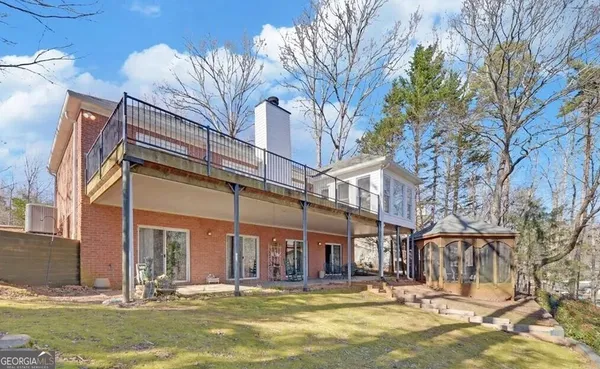 a view of a building with a large tree