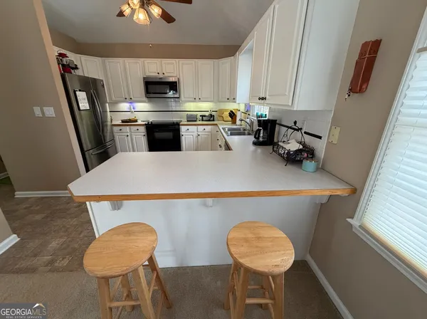 a bathroom with a bathtub and a sink