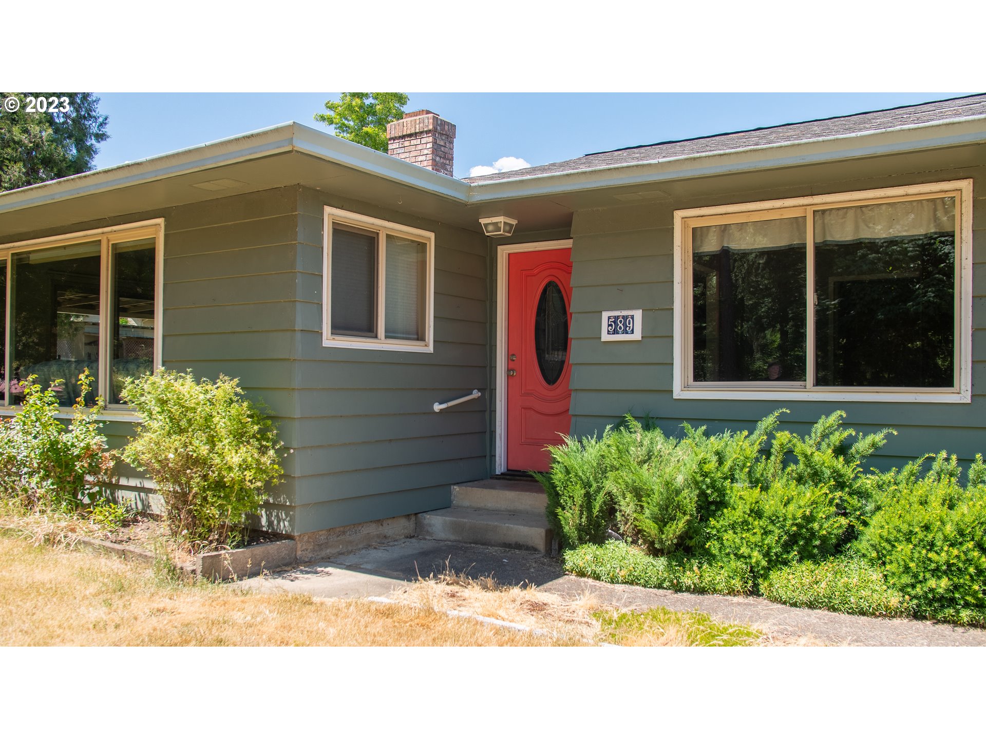 a front view of a house with a yard