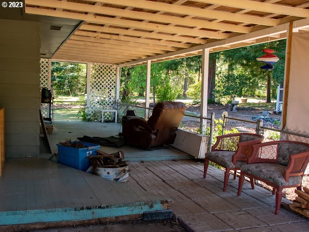589 Lockwood Road Roseburg, OR 97471 - Photo 15 of 32 a living room with furniture and floor to ceiling windows