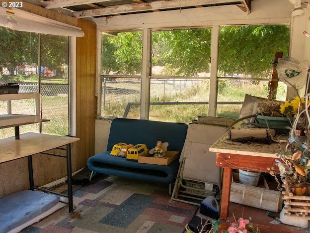 589 Lockwood Road Roseburg, OR 97471 - Photo 22 of 32 a living room with furniture and a floor to ceiling window