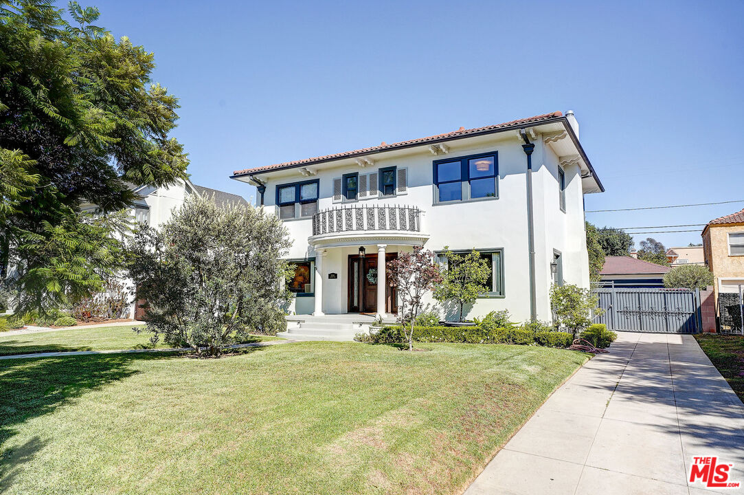 1944 Virginia Road Los Angeles, CA 90016 - Photo 1 of 36 a front view of a house with a yard