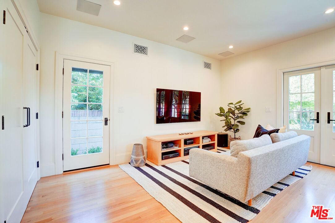 1944 Virginia Road Los Angeles, CA 90016 - Photo 11 of 36 a living room with furniture and a flat screen tv