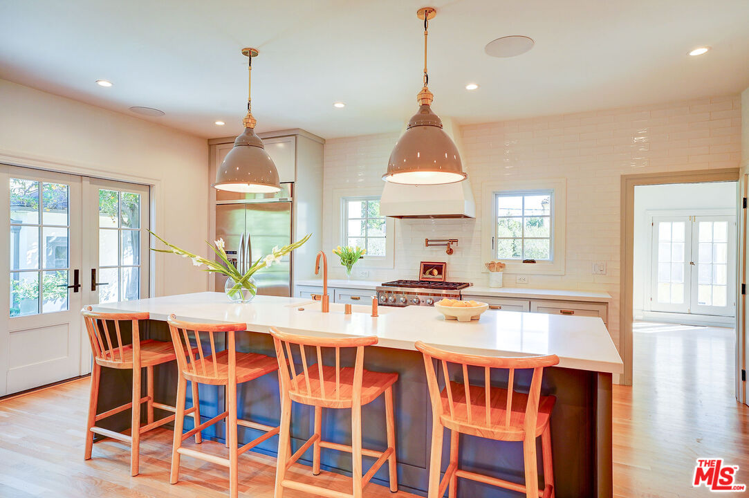1944 Virginia Road Los Angeles, CA 90016 - Photo 15 of 36 a view of a kitchen with a table and chairs