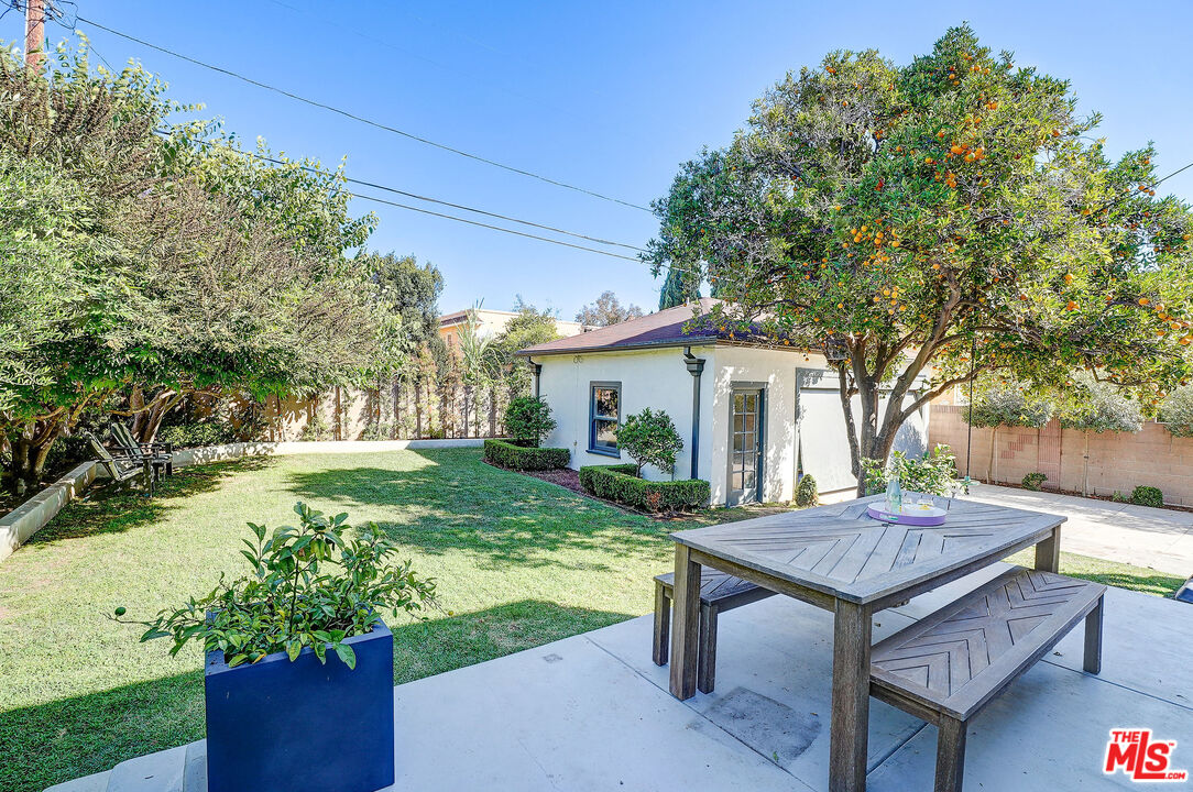1944 Virginia Road Los Angeles, CA 90016 - Photo 29 of 36 a view of a backyard with table and chairs with a yard and plants