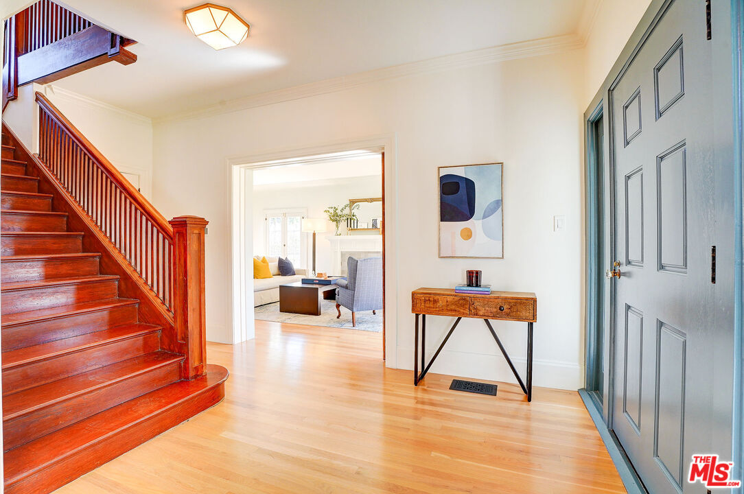 1944 Virginia Road Los Angeles, CA 90016 - Photo 5 of 36 a view of front door with chair and wooden floor