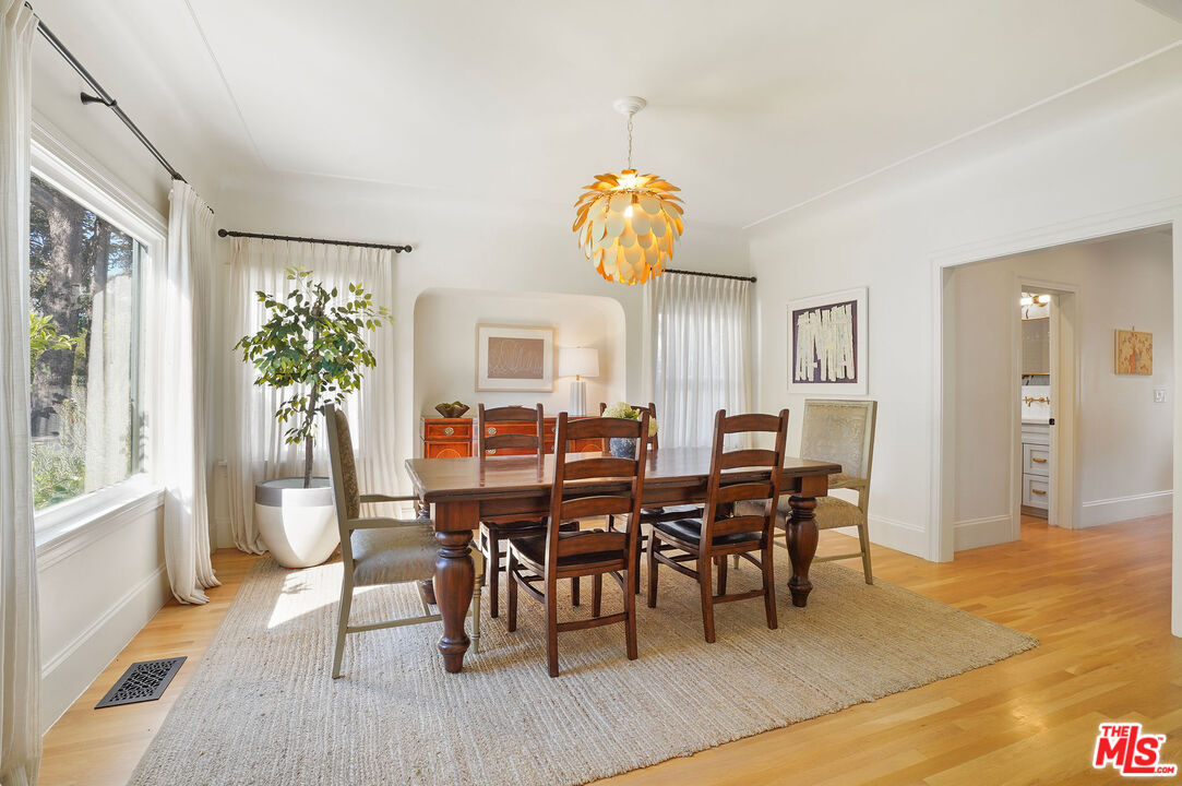 1944 Virginia Road Los Angeles, CA 90016 - Photo 9 of 36 a view of a dining room with furniture and wooden floor
