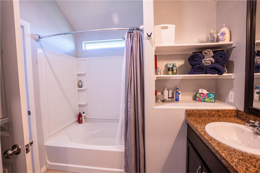 753 Rutherford Drive Crowley, TX 76036 - Photo 20 of 26 Bathroom featuring a tub and shower combination with a small transom window