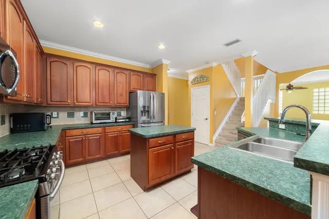 a view of a room with a ceiling fan and a window