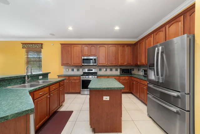 a view of a livingroom with a ceiling fan and window