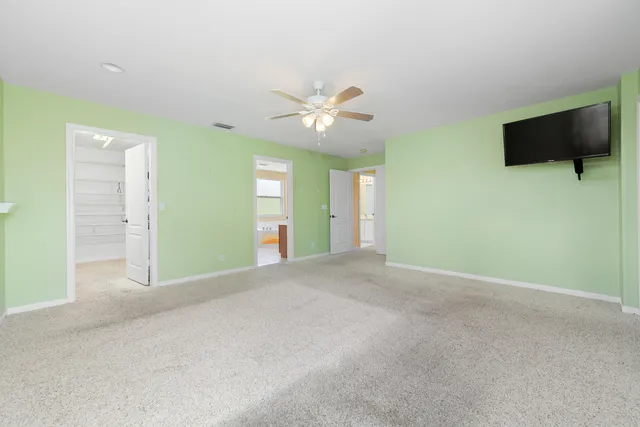 a bathroom with a tub a sink and a mirror