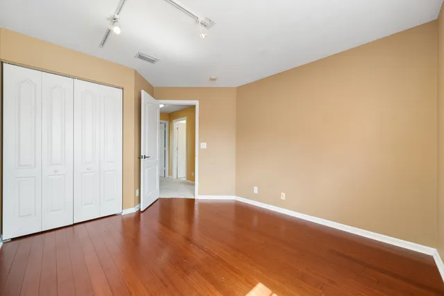 an aerial view of a house with a yard and a fountain