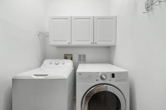 an aerial view of house with yard lake and ocean view