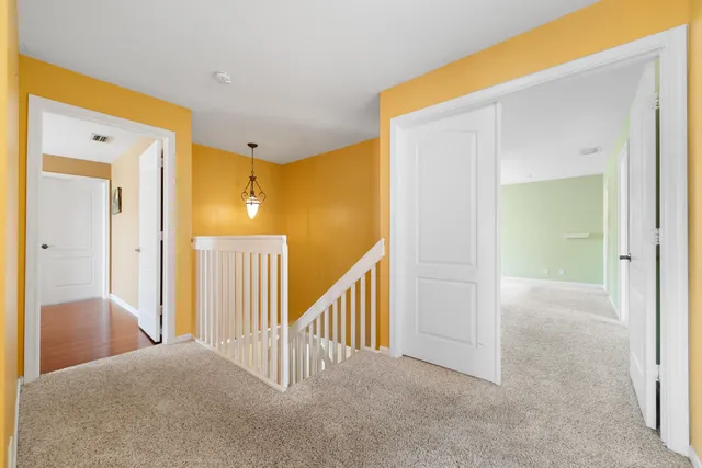 a picture of a bench in front of a wall