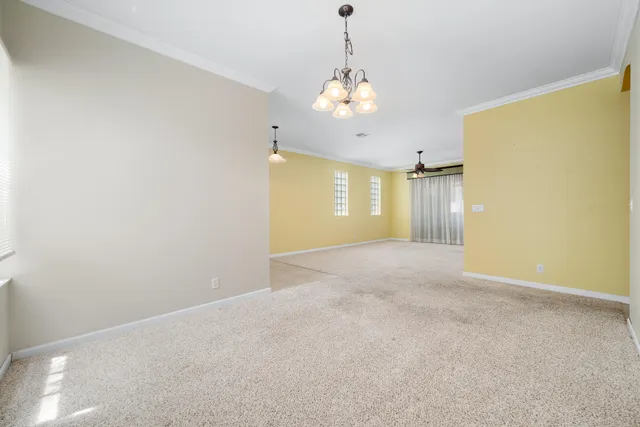 a dining room with furniture and entryway