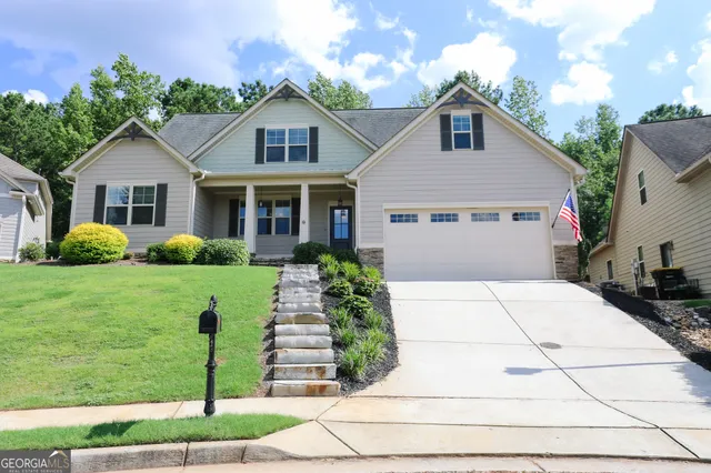 a front view of a house with a yard