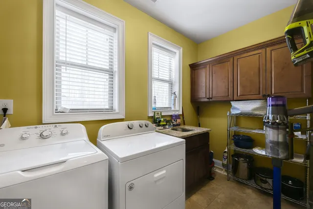 a view of storage and utility room with washer and dryer