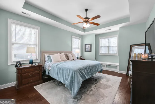 a bedroom with a large bed and a window