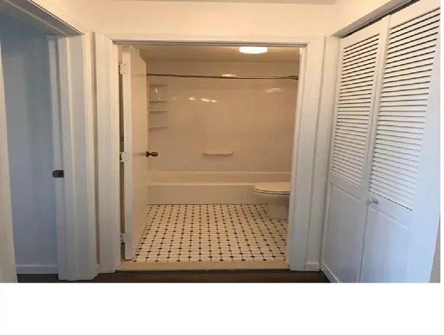 a black and white photo of a bathroom