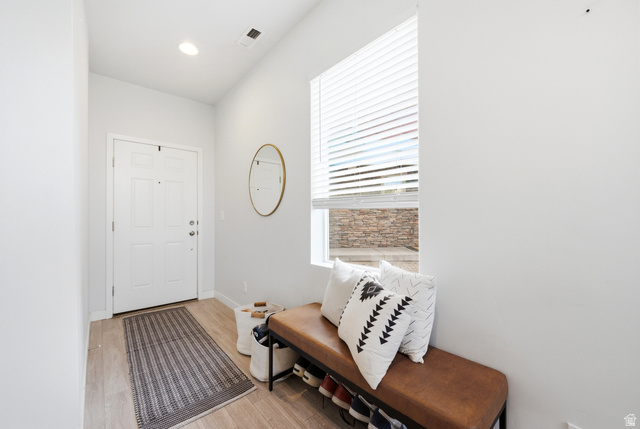 862 Founders Point Lane South Midvale, UT 84047 - Photo 2 of 45 Entryway with wood-finish flooring, a white paneled door, and a recessed ceiling light