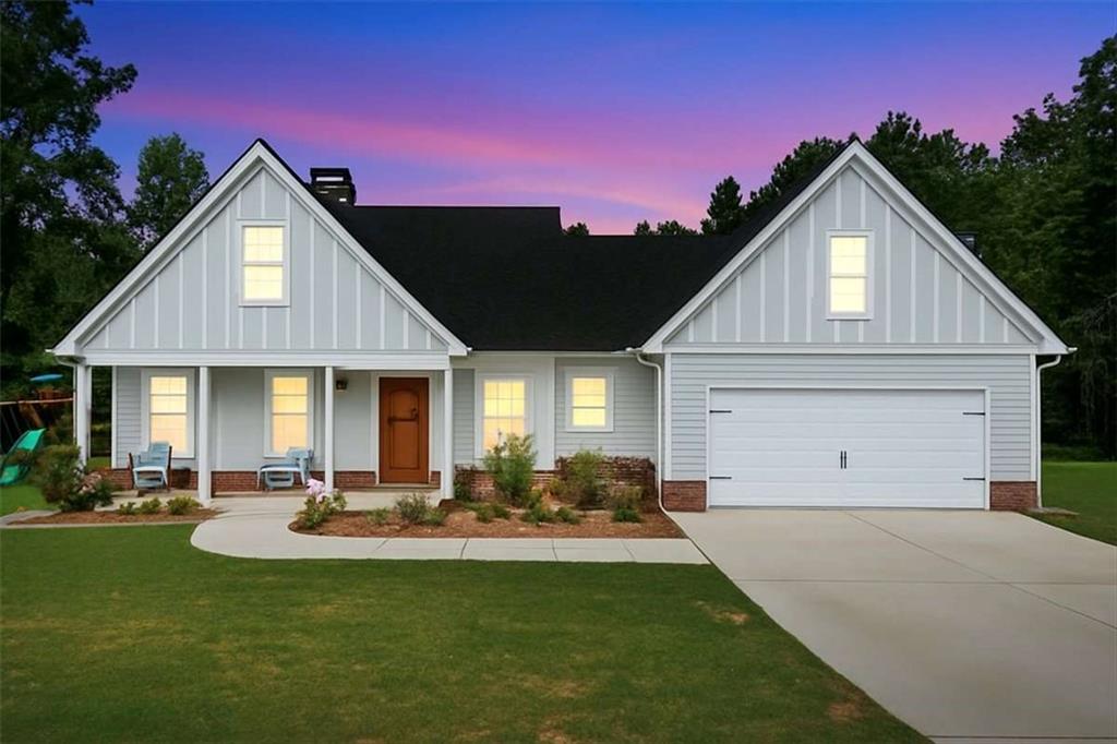 62 Joe Rowell Road Buchanan, GA 30113 - Photo 2 of 63 a front view of a house with a yard