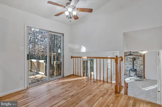 a kitchen with stainless steel appliances a stove top oven a refrigerator and cabinets