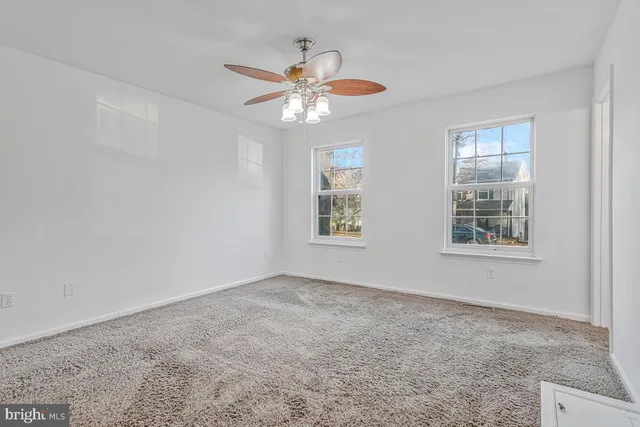 a view of an empty room and cabinet