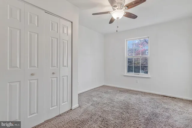 an empty room with fan