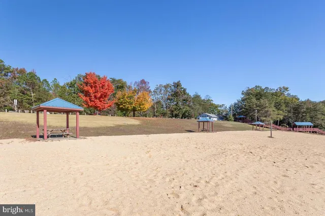 a view of a playground with basketball court