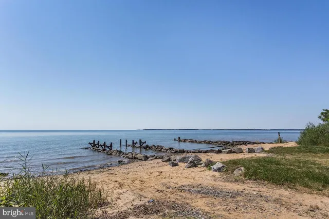 a view of a lake with houses in the back