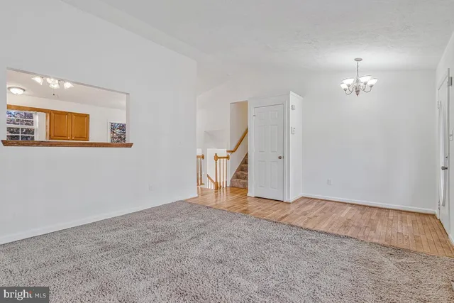 a kitchen with stainless steel appliances granite countertop a stove cabinets and wooden floor