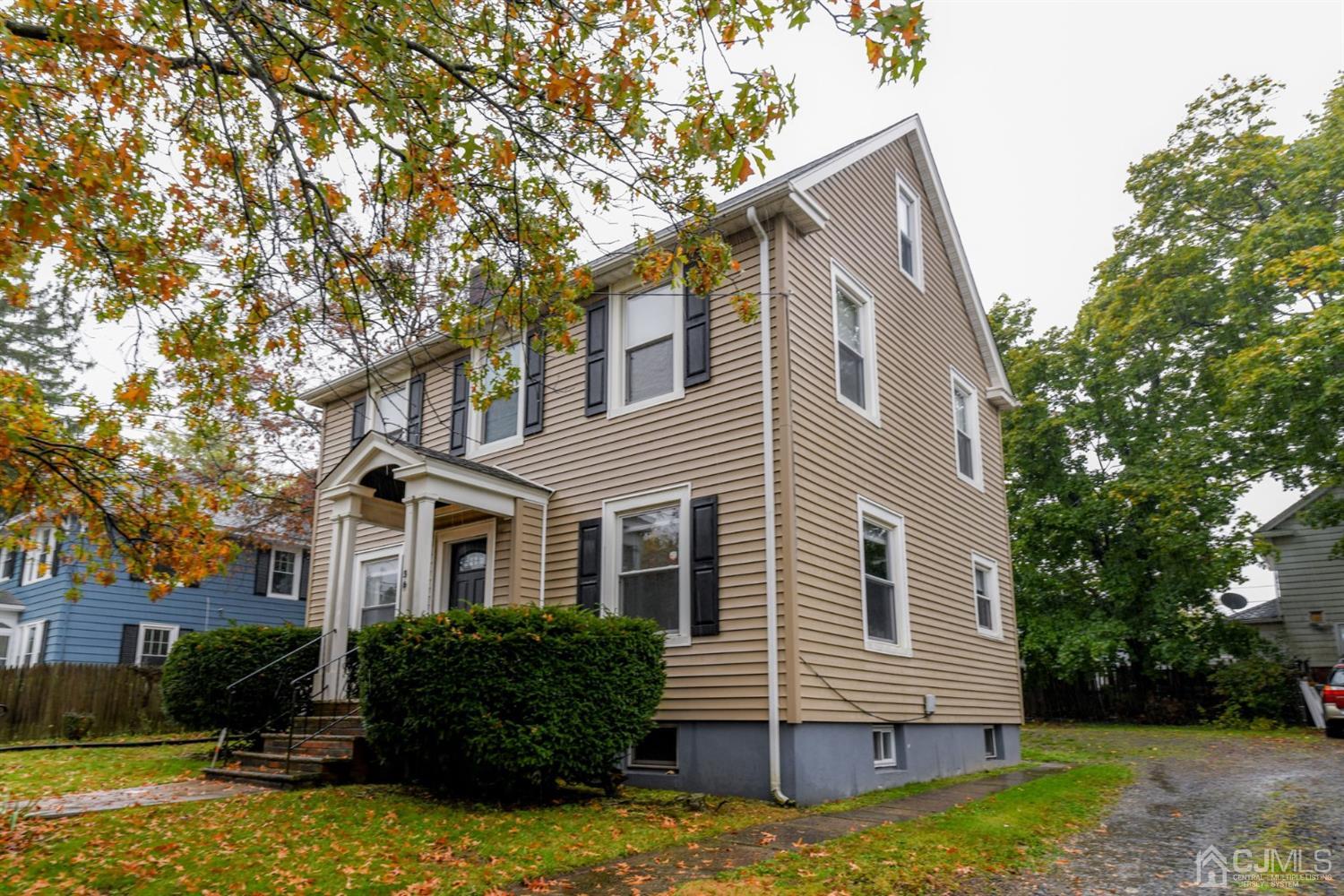 36 Baldwin Street New Brunswick, NJ 08901 - Photo 1 of 22 a front view of house with yard and trees in the background
