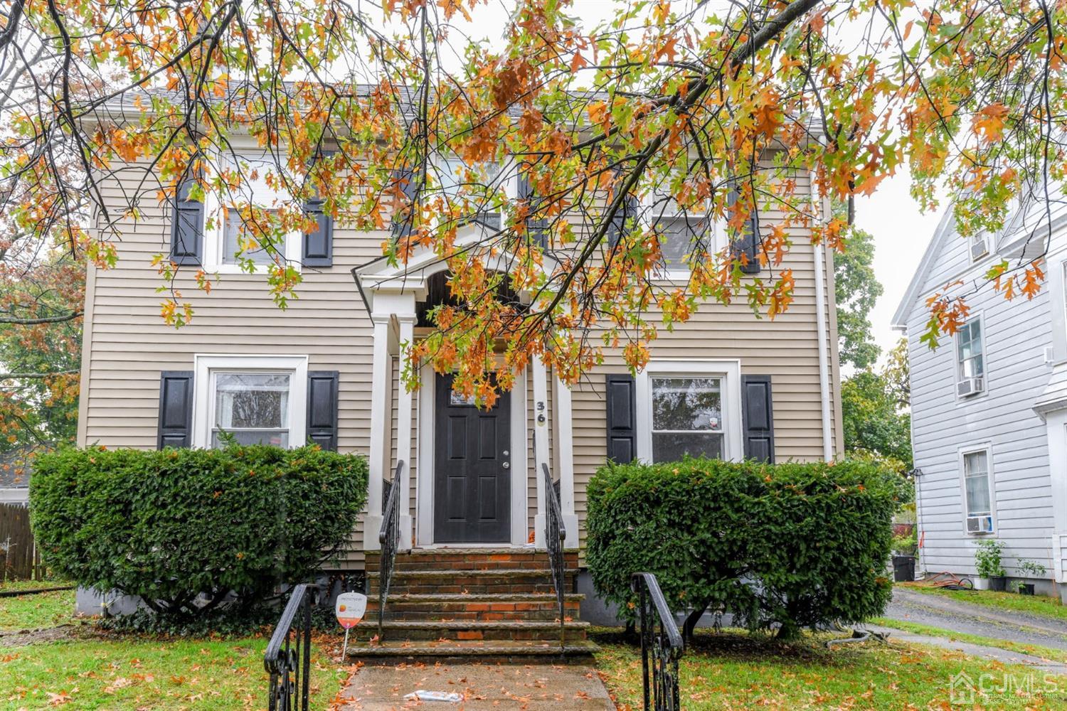 36 Baldwin Street New Brunswick, NJ 08901 - Photo 2 of 22 front view of a house with a yard