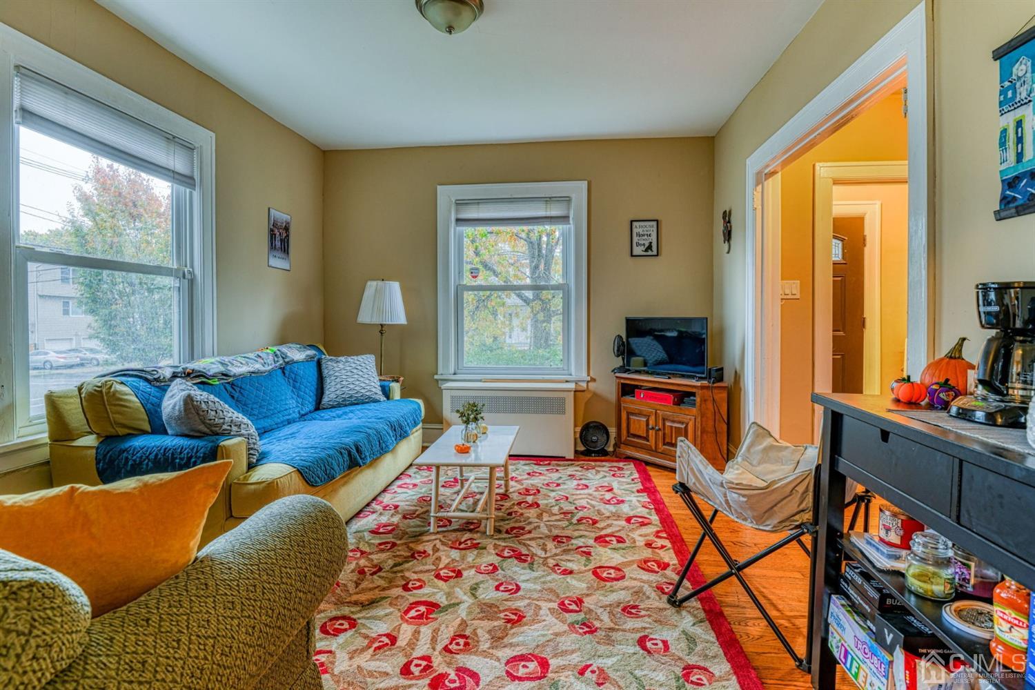36 Baldwin Street New Brunswick, NJ 08901 - Photo 11 of 22 a living room with furniture and a window