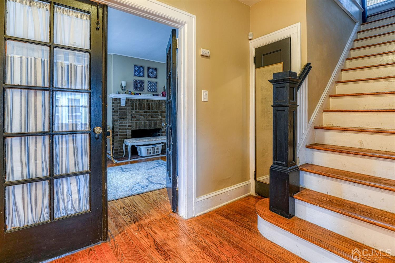 36 Baldwin Street New Brunswick, NJ 08901 - Photo 15 of 22 a view of a hallway with wooden floor and entryway