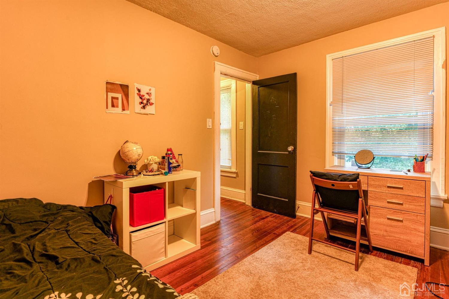 36 Baldwin Street New Brunswick, NJ 08901 - Photo 17 of 22 a view of a workspace with furniture and a window