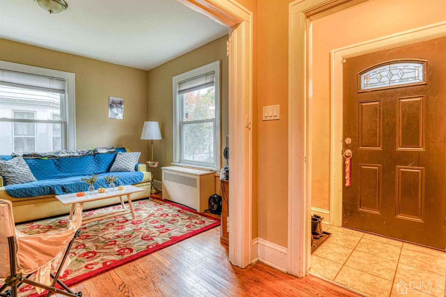 36 Baldwin Street New Brunswick, NJ 08901 - Photo 8 of 22 a living room with furniture and a window