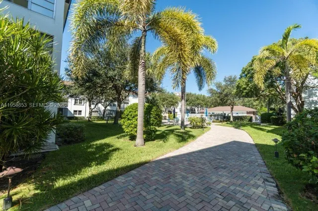 a view of a backyard with swimming pool