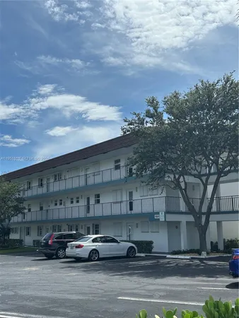 a cars parked in front of a building