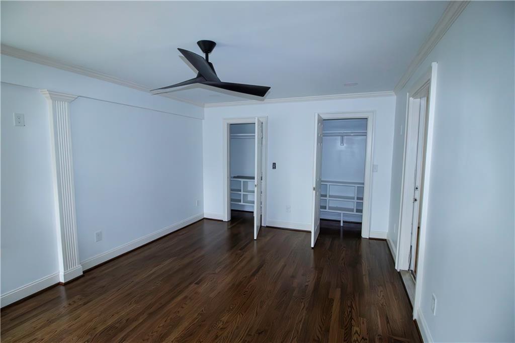 1292 Monfort Road Lawrenceville, GA 30046 - Photo 21 of 48 a view of empty room with wooden floor and ceiling fan