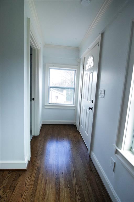 1292 Monfort Road Lawrenceville, GA 30046 - Photo 22 of 48 an empty room with wooden floor and windows