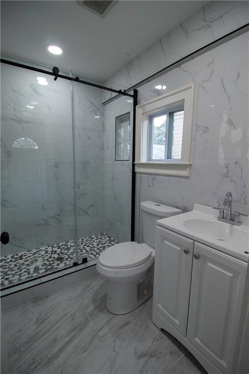 1292 Monfort Road Lawrenceville, GA 30046 - Photo 23 of 48 a bathroom with a sink toilet and shower