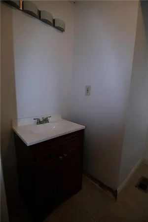 a view of a hallway and a livingroom with furniture