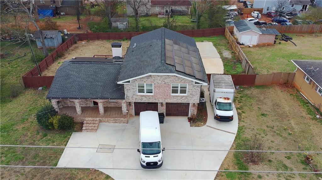 1292 Monfort Road Lawrenceville, GA 30046 - Photo 43 of 48 an aerial view of a house with swimming pool and patio