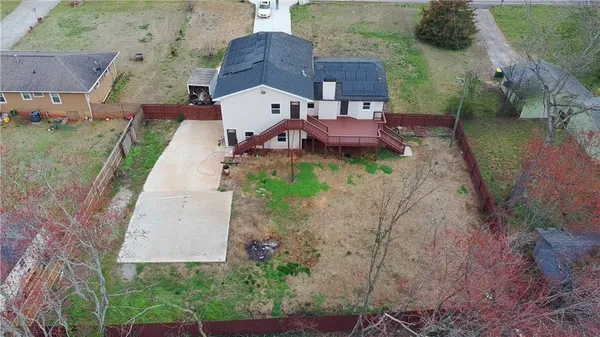an aerial view of a house with a garden